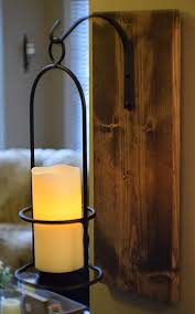 Set of three rustic wrought iron pillar candle holders rainbowconnection15 5 out of 5 stars (423) $ 49.95. Amazon Com Rustic Large Wrought Iron Hanging Candle Sconce 6 Inch Led Candle With Flickering Light And 6 Hour Timer Handmade In The Usa Farmhouse Decor Kitchen Dining