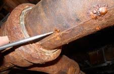 Rotted castiron pipe cut out and replaced ,castiron pipe in floor is rotted also that will have to be another day to fix that part drilling out a lead joined pipe from a cast iron hub and replacing it with pvc via a fernco donut. How Can I Repair A Nail Head Size Leak On A Vertical Cast Iron Sewer Pipe In My Basement Home Improvement Stack Exchange
