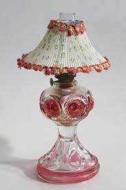 The shade of the lamp is trimmed in gold top and bottom and has. Oil Lamps And Lanterns