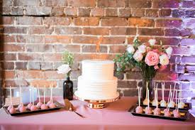It is also a nice choice for daily use,entertaining at home,housewarming gift,restaurant,hotel and etc. Industrial Chic Blush Pink Wedding Reception Dessert Table With Two Tier Round White Wedding Cake With Custom Groom Lifting Bride On A Dumbbell Gold Silhouette Cake Topper And Gold Cake Stand And