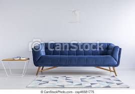 Build the farmhouse coffee table for under $40 with just a drill and a saw! Comfortable Blue Couch And Wooden Coffee Table In Simple White Apartment Canstock