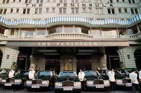 The Peninsula Hotel S Gleaming Fleet Of Rolls Royces And Their Chauffeurs This Fleet Replaces The 26 Million Dollar Flee Peninsula Hotel Rolls Royce Hong Kong