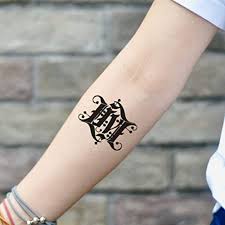 This bgf tattoo displays a black dragon attacking a prison gun tower. Amazon Com Family Crest Coat Of Arms Temporary Tattoo Sticker Set Of 2 Www Ohmytat Com Beauty