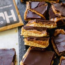 Sour golden berries hunks, cashew and vanilla bean hunks, as well as almond and sea salt hunks. Hu Kitchen Vegan Chocolate Certified Paleo By The Paleo Foundation