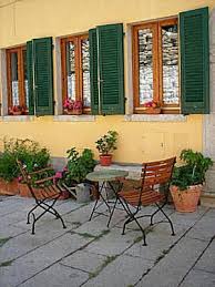 How To Decorate Your Home In The Tuscan Style Tuscan Decorating Patio Decor French Country Decorating