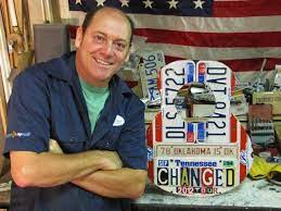 Old tree logs are cut into various shapes and then the letters from number plates were used to make. Peter Geiger License Plate Guitar Imagine Strat Inhabitat Green Design Innovation Architecture Green Building