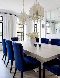 You should also consider hanging height when determining the size of the chandelier you will hang over your dining room table. Two Chandeliers Over Dining Table Design Ideas