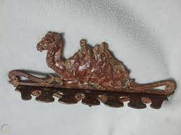 Scan the books in the. Antique Cast Iron Victorian Camel Wall Pipe Holder Bar Pool Cue Rack Judd Mfg Co 1809793494