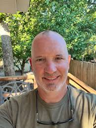 My LinkedIn photo is a lie. There, I came clean. No, it's not AI-generated.  Kjell Gerber shot that in our company parking lot a few years ago. But I've  changed this summer.