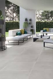Limestone is a softer, more porous stone, so you'll need to seal these tiles to protect them from stains and weather damage. Indoor Outdoor Living Living Room Tiles House Flooring Tile Floor Living Room