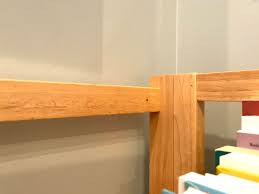 It is best to secure the bookcase without the books in it, and then fill it up once you are finished. How Do I Secure An Open Backed Set Of Shelves To The Wall Home Improvement Stack Exchange