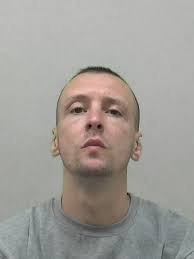 Thug who stabbed man in his own living room jailed