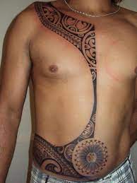 The tattoo covers the upper section of the arm, and it spreads around the right shoulder. 46 Magnificent Tribal Tattoos On Stomach