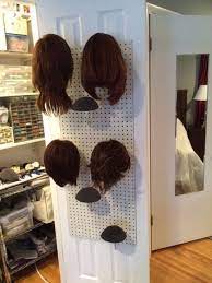My Current Wig Storage Solution That I Built On The Inside Door Of My Craft Closet Wig Storage Hair Product Storage Wig Storage Ideas