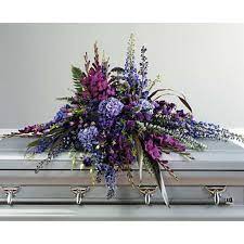 The immorata casket spray offers soft beauty and blushing comfort to honor the life of the deceased. Garden Casket Spray Florist Flower Shop Calgary Flower Delivery Calgary Flowers Downtown Florist