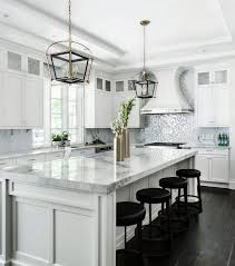 White Kitchen White Kitchen Cabinet White Kitchen With Stacked Wall Cabinets Custom Range Hood An Kitchen Cabinets Decor White Kitchen Design Home Kitchens