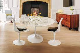 The dining table will take your dining room from drab to fab! The Story Behind Eero Saarinen S Iconic Pedestal Table Architectural Digest