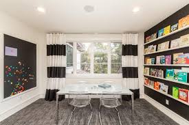 Black And White Kids Play Room By Using A Black And White Color Scheme For The Walls Carpet And Furnishings This Chic Playroom Lets The Accessori With Images White Kids Room Modern Kids Room Kids Room