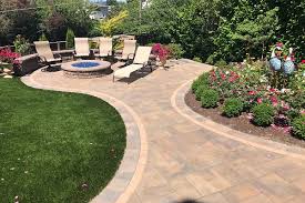 When placing this fire pit on grass, ensure you have a fire pit mat or sand underneath the fire pit to protect your lawn. Patio Gas Fire Pit Retaining Wall And Artificial Grass Expert Paver Company