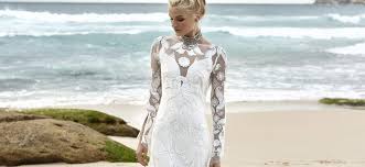 A crepe gown featuring a high neckline with sheer trim accents throughout the bodice. The Bride Lab Wedding Dresses Adelaide South Australia