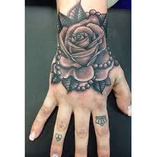 Erykah Badu Couture Laurakennedytattoo Doing This Rose With Pearls On The Wrist Tattoos For Women Hand Tattoos Rose Tattoos For Women