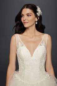 Plunging V Neck Wedding Gown With Tiered Skirt David S Bridal Bridal Beauty Dramatic Wedding Dress Bride Beauty
