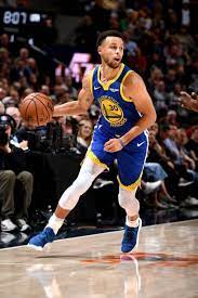 Stephen Curry of the Golden State Warriors handles the ball against...