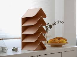 Brick wall home bookshelf with lamp and rug. Meet The Wisdom Tree A Bookshelf That Looks Like A Christmas Tree And Works Like An Ambient Lamp Yanko Design
