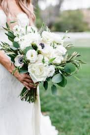 Wedding bouquets come in many different shapes and sizes. Lush White And Green Organically Gathered Bridal Bouquet Anemone And Full White Bloom B White Wedding Bouquets Poppy Wedding Bouquets Elegant Wedding Bouquets