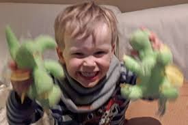 Claw arcade game boy grabs prizes ... by climbing inside machine