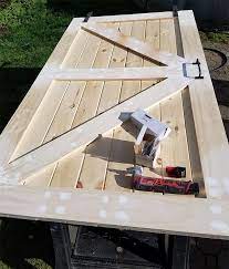 The tongue and groove shiplap is the base of our door so we trimmed each of those planks to 7′ tall. Tongue And Groove Sliding Barn Door Woodworking