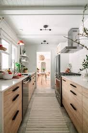 A Drab Galley Kitchen Gets A Modern Transformation At The Midwest Malibu Cottage Front Kitchen Design Small Galley Kitchen Design Galley Kitchen Renovation