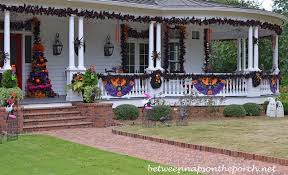 In continuation of the beautiful victorian halloween sweets table by sweets indeed, here's a peek at the coordinating invitations, escort cards (candy licorice pipes & paper butterflies!!), and accent decor. Beautiful Victorian Home Aglow For Halloween Between Naps On The Porch