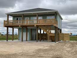 Many lots in coastal areas (seaside, lake and river) are assigned base flood elevation certificates which dictate how high off the ground the first living level of a home must be built. Small Modern Stilt House Plans Novocom Top