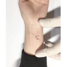 65 Moon Tattoo Design Ideas For Women To Enhance Your Beauty Flower Wrist Tattoos Moon Tattoo Wrist Moon Tattoo