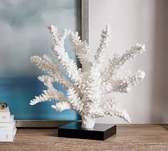 An eclectic grey, white and coral living room with a dark rustic coffee table, bright coral pillows and blooms and vintage mirrors as decor. Faux Coral On Stand Coral Decor Shop Decoration Decorative Objects