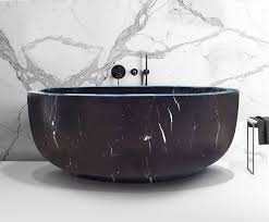 Whirlpool bathtubs offer adjustable jets and easy to reach controls. 30 Stone Bathtubs That Will Rock Your Bathroom In Pictures