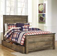 Whether she loves horses or he's a cowboy at heart, trinell full panel headboard matches their authentic sense of style. Signature Design By Ashley Trinell Rustic Look Full Panel Bed With Under Bed Storage Trundle Royal Furniture Panel Beds