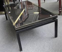 Pair of french metal & brass gueridons by pierre vandel, 1970s. A 20th Century Rectangular Parcel Gilt Ebonised Coffee Table By Pierre Vandel Paris 105cm X 54