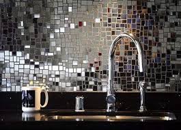 .upon a tile backsplash with a matching tile mirror frame in a commercial building. Pin On Bathroom