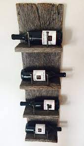 Due to the nature of reclaimed wood no piece is exactly alike, variations such as cracks, knots, etc add to the piece's character. Stunning Reclaimed Wood Wine Rack With Remarkable Detail And An Industrial Edge Takes Any Dining Room Or Wine Bar Up A N Drivved Inredning Vinstall Vinlagring