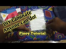 Then take a second sheet and place it on top of the sheet of paper, sticky side down. Diy Laminate Using Plastic Cover And Iron Youtube