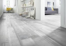 White wall kitchen interior with a dark wooden floor white closets. Spirit Bohm Laminate Flooring Tapi Carpets Floors