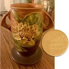 Maybe you would like to learn more about one of these? Roseville Water Lily Vase Kovels