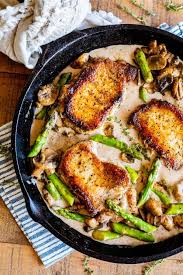 Creamy Pan Seared Pork Chops With Asparagus From The Food Charlatan Creamy Pan Seared Pork Chops Is Such An Easy Pan Seared Pork Chops Seared Pork Chops Pork