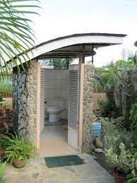 Check out these gorgeous blue cabinets and brass fixtures. 24 Marvelous Outdoor Bathroom Design For Perfectly Bathroom Ideas Outdoor Pool Bathroom Outdoor Bathroom Design Outdoor Bathrooms