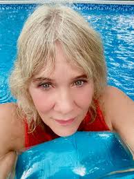 swimming in the rain in an above ground pool