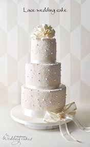 This Stunning Ivory Wedding Cake Is Covered In Sugar Paste Icing And Expertly Hand Decorated Wedding Cake Pearls Rustic Wedding Cake Toppers Lace Wedding Cake