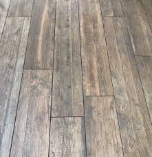 You can find proper grey floors for modern, minimalist, rustic and other décor styles, and the good news is scratches and spots won't strike the eye on grey like it would be with polished black floors, for example. Reclaim Reclaimed Wood Effect Range Of Italian Porcelain Hard Rock Flooring