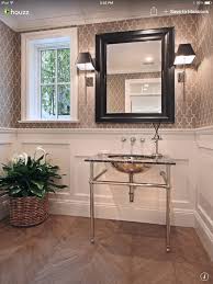 One topic we talked a little about today was wainscoting, particularly picture molding on the lower part of a wall under a chair rail. Graphic Wallpaper Powder Room Design Traditional Powder Room Home